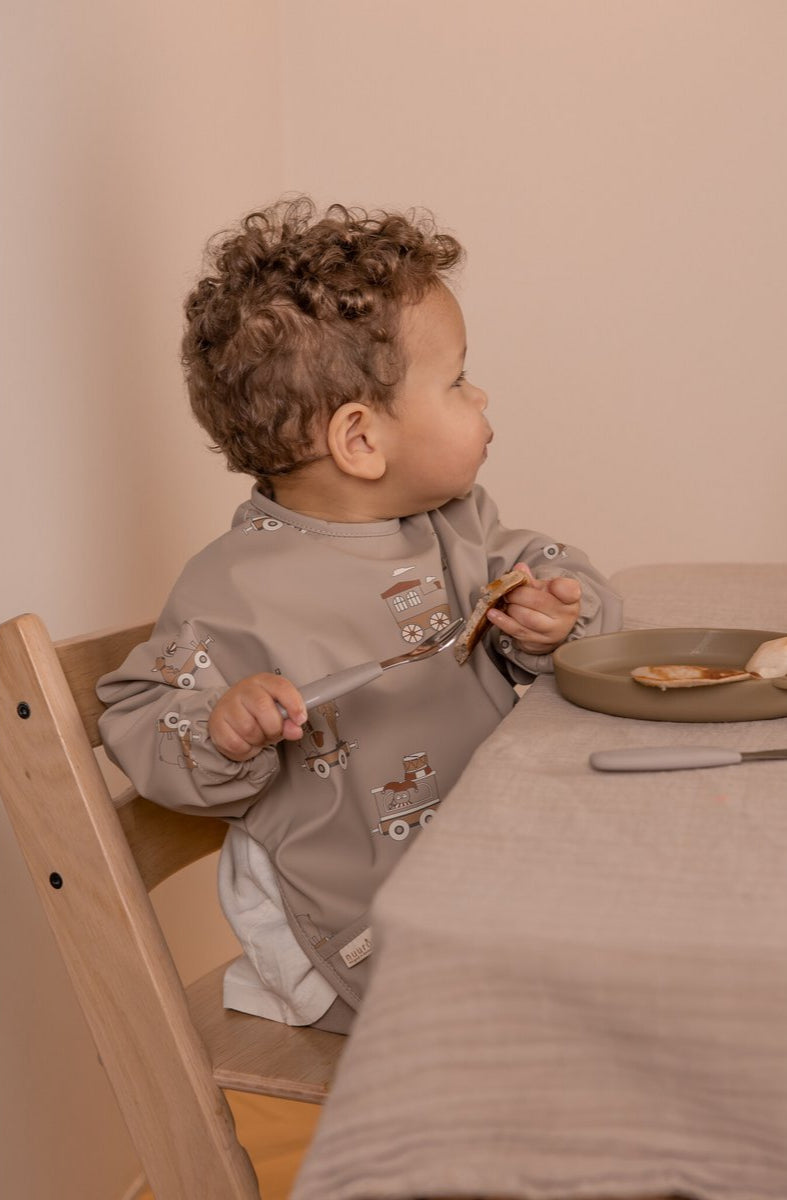 Abwischbares Ess-Lätzchen für Babys mit Karnevalszug-Design