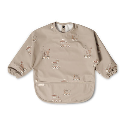 Langarm-Lätzchen „Karneval“ mit Karnevalszug-Print in Creme von Nuuroo